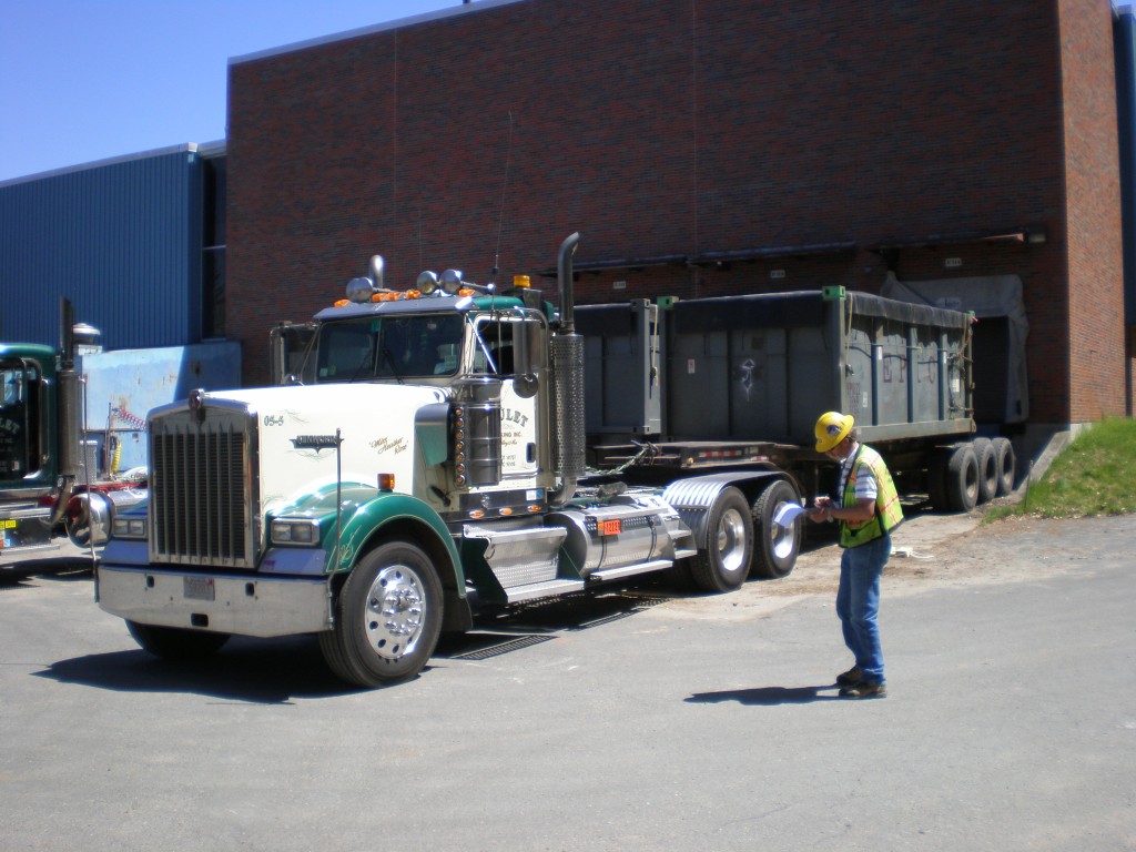 First truck pulling out of the building loaded for waste shipment.